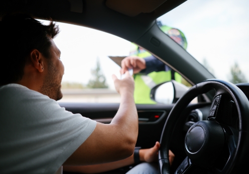 Police officer carrying out a road traffic inspection in Portugal.