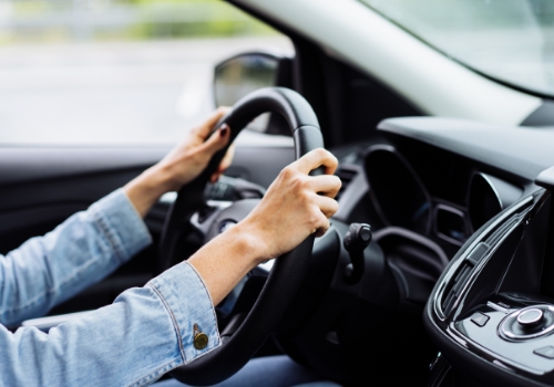 Woman driving a modern car.