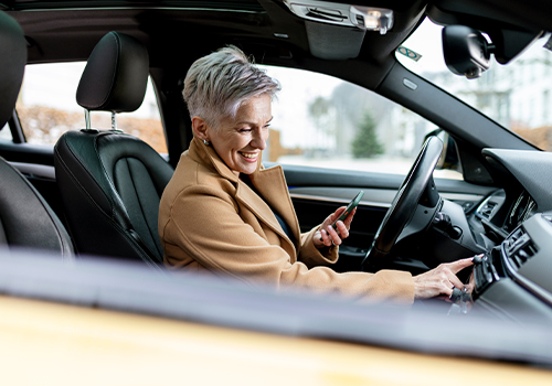 Woman using a car through a subscription service