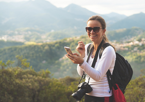 Traveller using a smartphone to check a travel itinerary