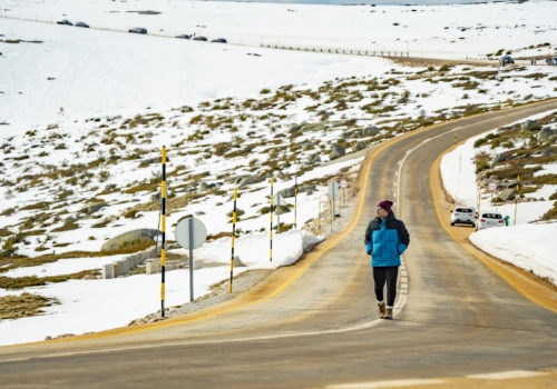 Man equipped for snow walking on the road
