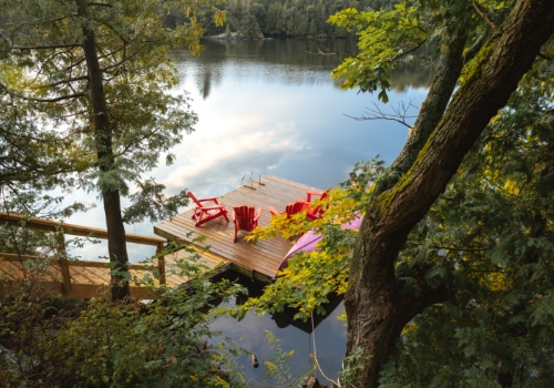 View of chairs on a dock by a lagoon
