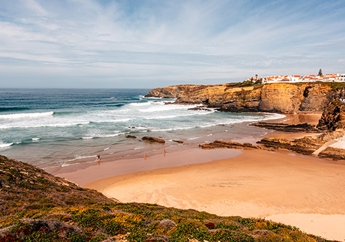 View of the beach and cliffs of Zambujeira do Mar on the Costa Vicentina coastline.