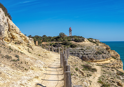 The Alfanzina Lighthouse located in the Seven Hanging Valleys Trail, Algarve.
